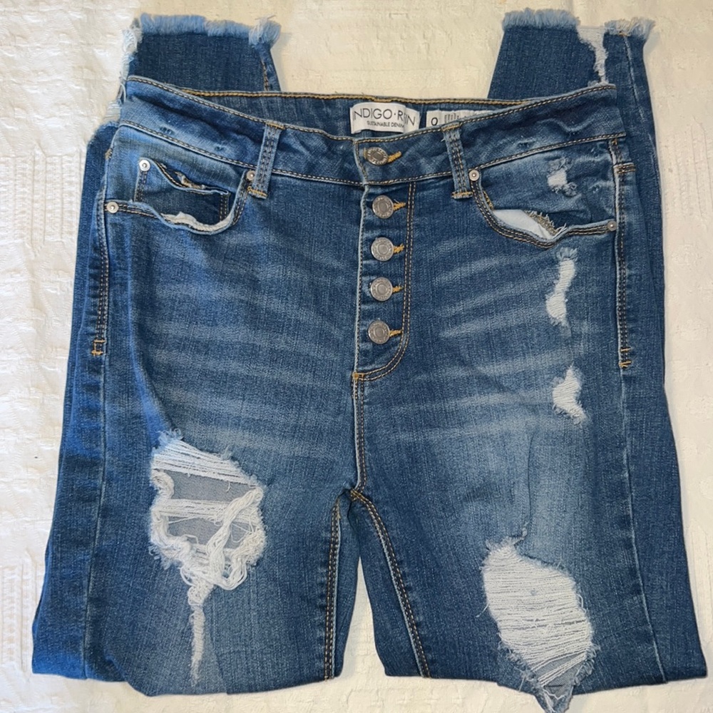 Indigo Reign button-fly distressed skinny jeans